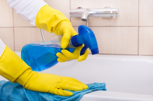 Professional carpet cleaners working carefully in a tidy room